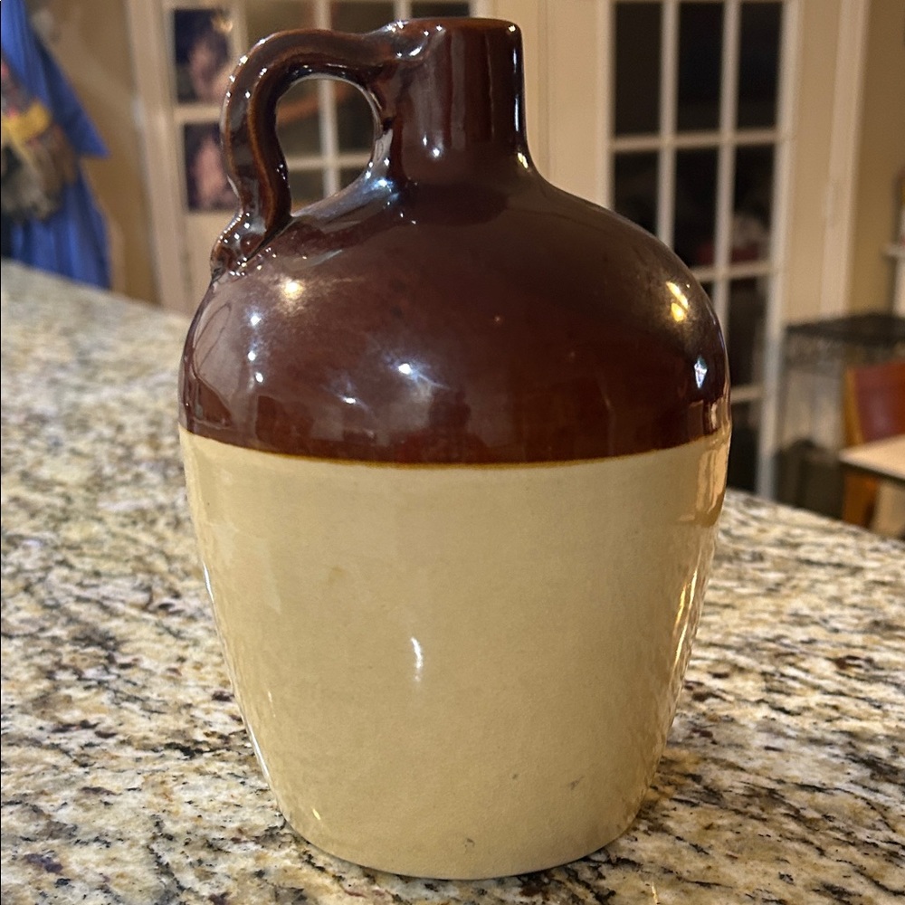 This item is a vintage Laird & Co stoneware liquor jug # 135-59